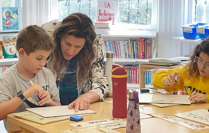 Lower School teacher Marissa Pennington works with student