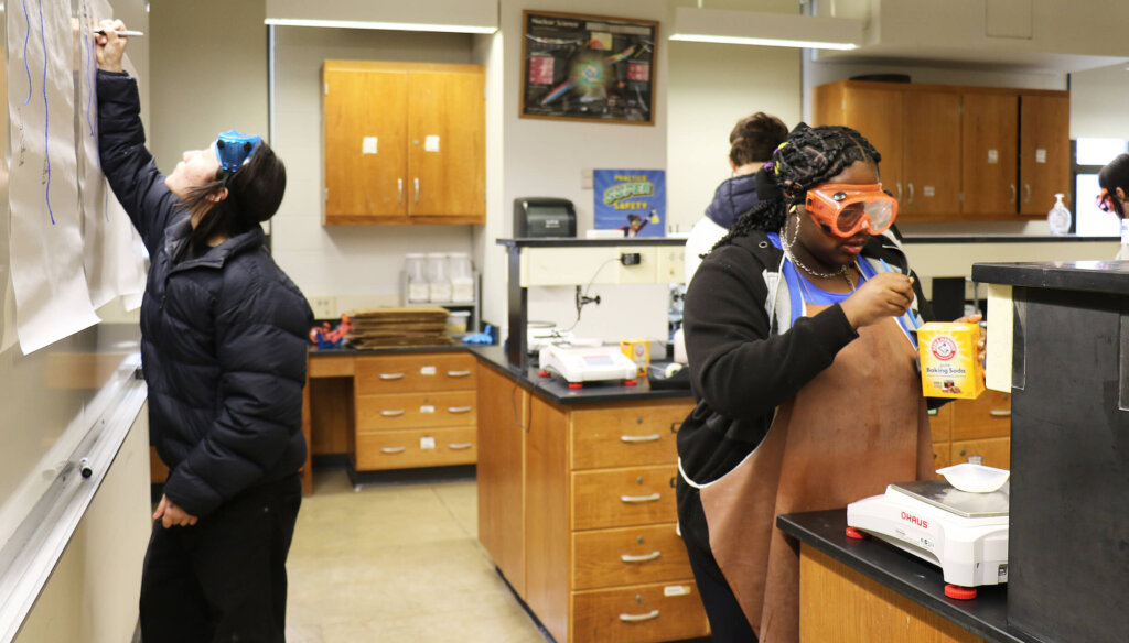 Students doing experiment in chemistry lab