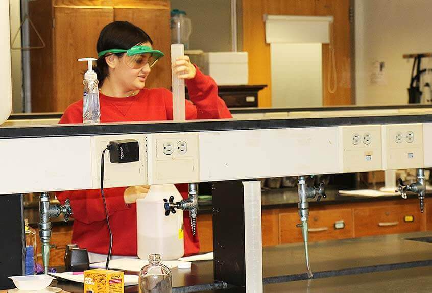 Student doing experiment in chemistry lab