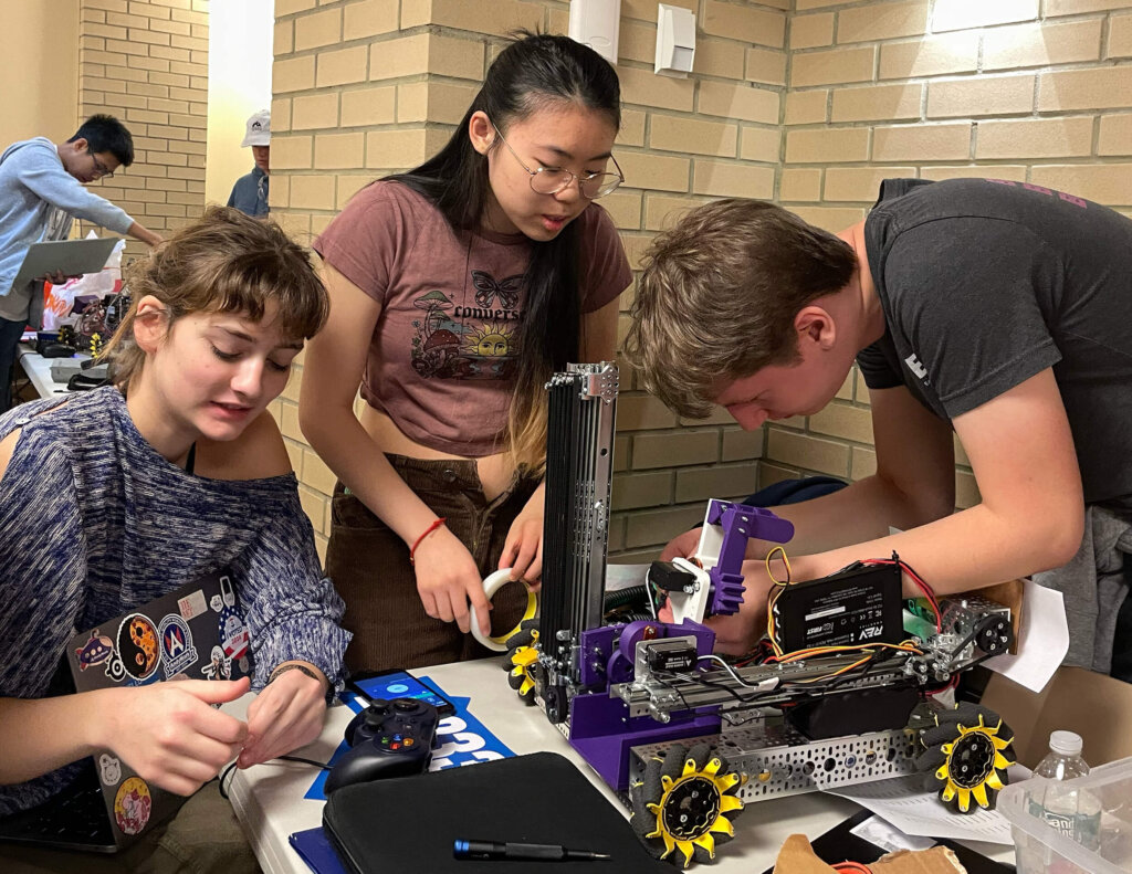 Antonia Smithmyer '25, Wendy Zhou '25, and Harry Lucas '25 working on robot