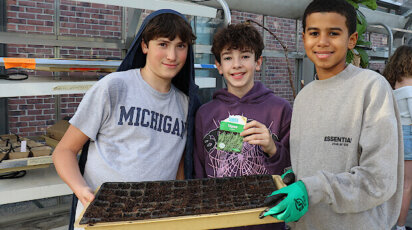 Middle School Urban Farming students in greenhouse