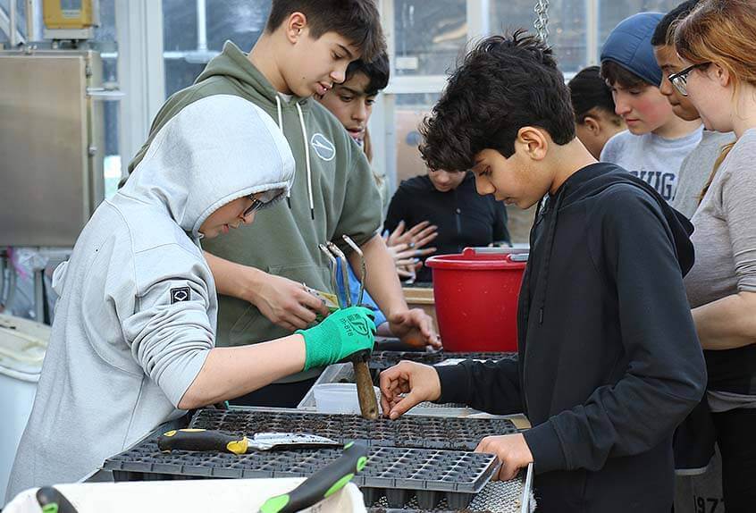 Urban Farming students preparing planter seed tray